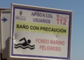 cartel baño con precaucion Horcas Coloradas, la playa ideal para el Poniente